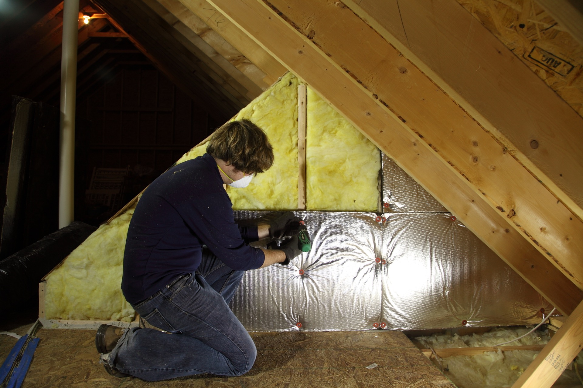 Attic insulation installation in progress